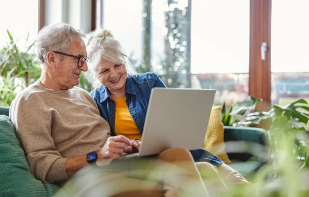 Mature Couple reviewing health insurance options online